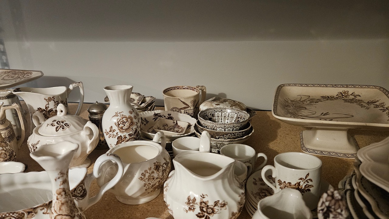 Large collection of brown and red transferware